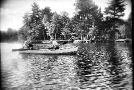 A
                rowboat in front of the resort in 1949